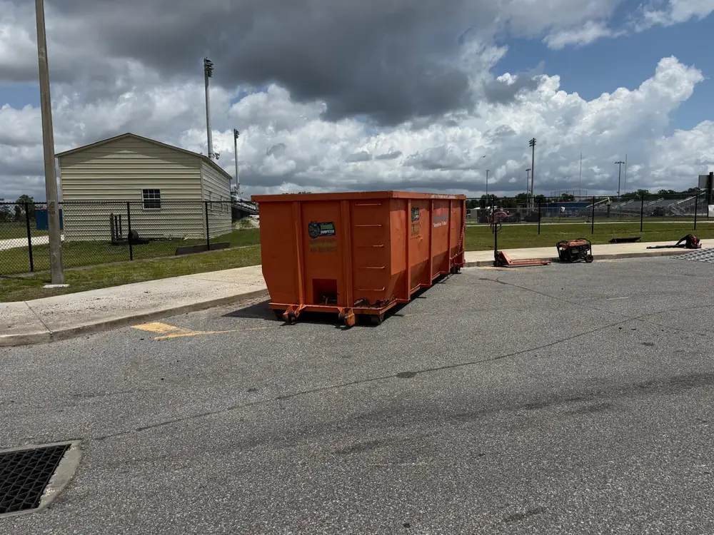 Dumpster Strong roll-off dumpster staged at an Orlando FL sports complex for a large-volume commercial and event cleanup