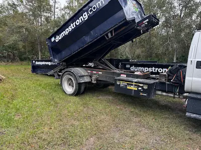 Construction dumpster rental on Orlando job site with Dumpster Strong container