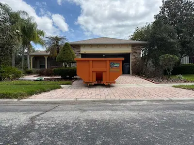 Properly placed dumpster on Orlando driveway