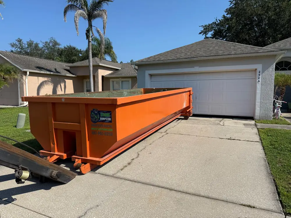 20 yard dumpster rental on a residential driveway in Kissimmee FL