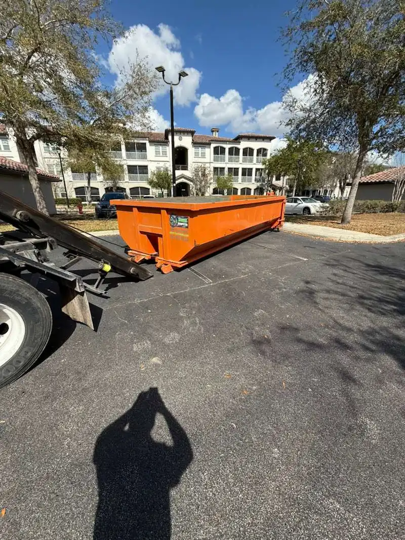 Dumpster Strong roll-off dumpster at an apartment complex near Clermont, FL