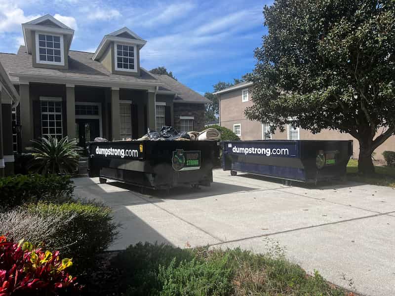 Dumpster Strong dumpsters on a residential driveway near Clermont, Orlando FL