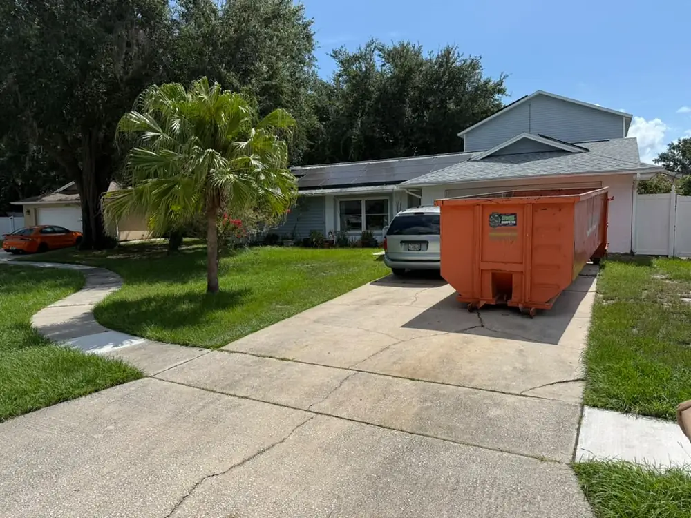Dumpster rental at an Orlando home with solar panels