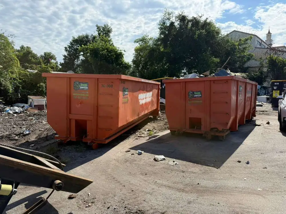 Two Dumpster Strong roll-off dumpsters, 30-yard and 20-yard containers, staged at the Central Florida yard ready for delivery