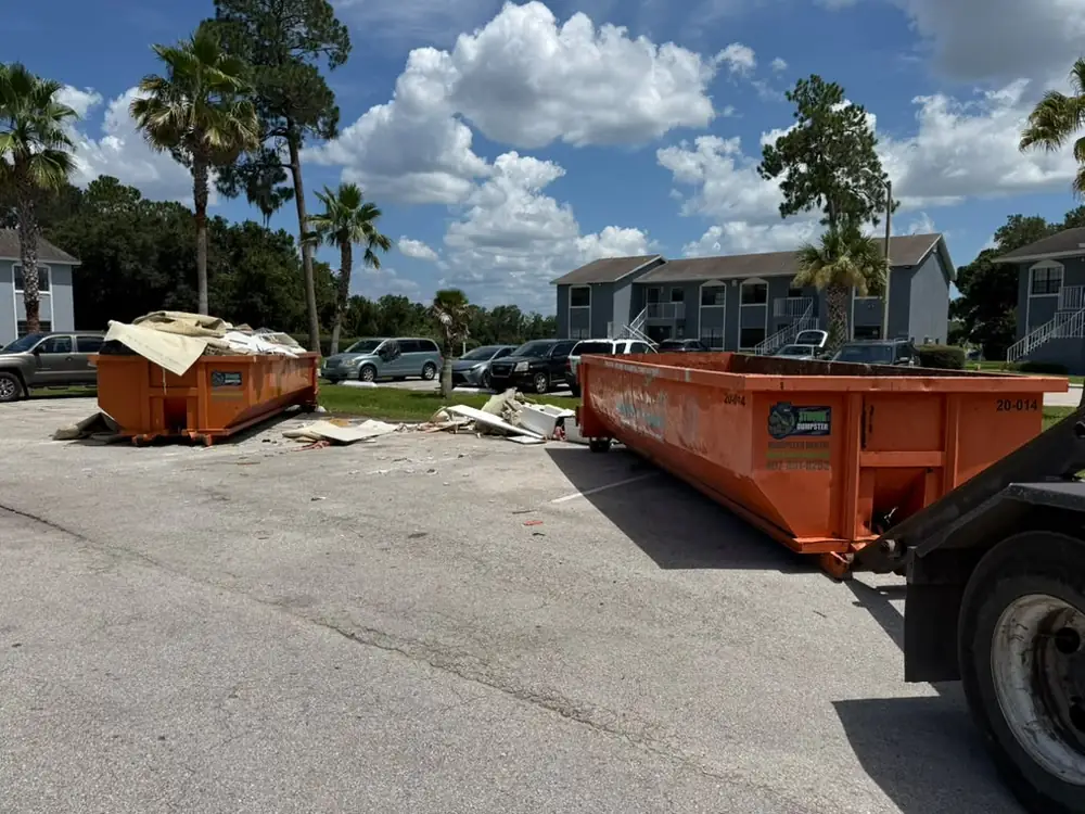 Two roll-off dumpsters during an apartment turnover for an Orlando property management company